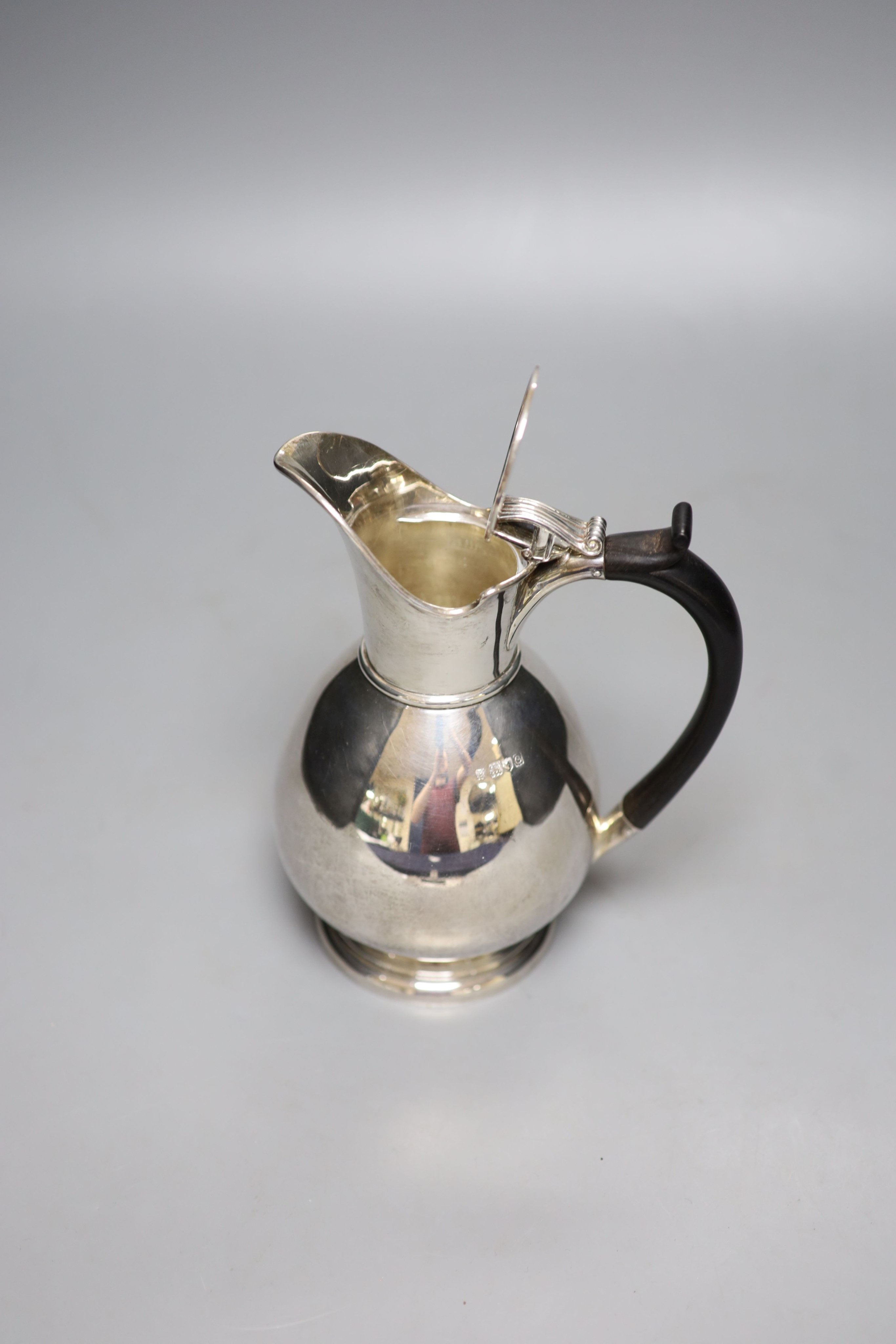 A late Victorian silver hot water jug, London, 1898, 19.2cm gross 14oz.